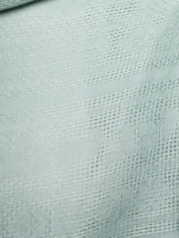 Textura de chal de baby alpaca en verde menta con tejido jacquard